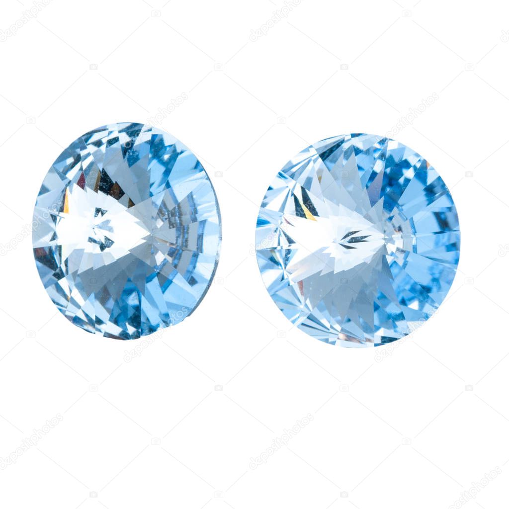 Large round blue crystal rhinestones. Front and side view. Isolated on white.