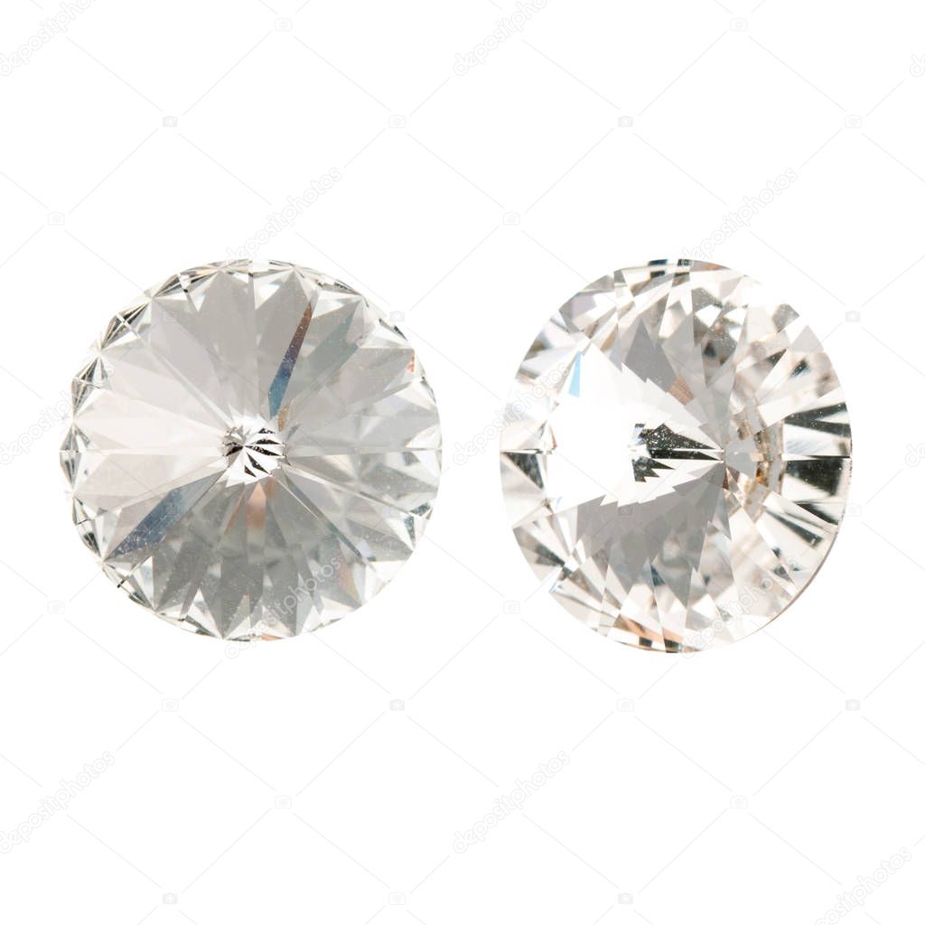 Large round white crystal rhinestones. Front and side view. Isolated on white.