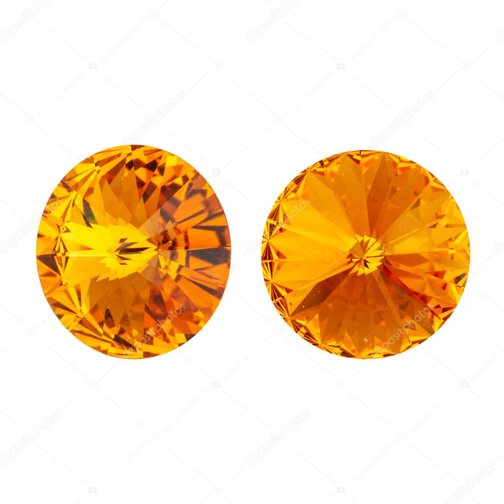 Large round orange crystal rhinestones. Front and side view. Isolated on white.