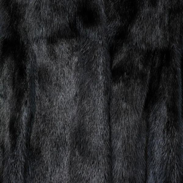 Textúra természetes fekete fényes szőrme gyönyörű hullámos redők — Stock Fotó