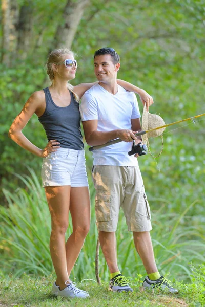 Woman and man fisshing together — Stock Photo, Image