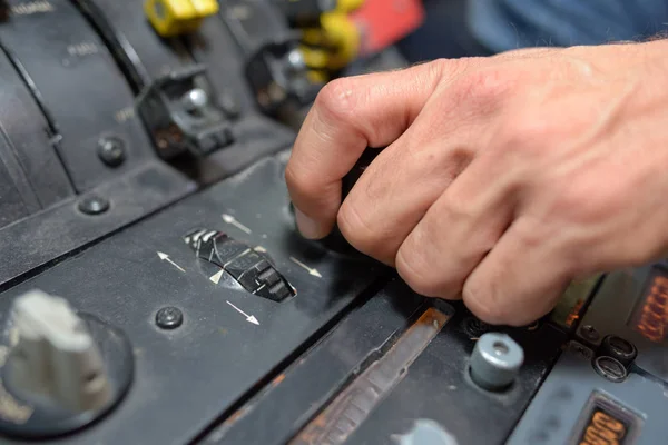 Closeup of hands on controls — Stock Photo, Image