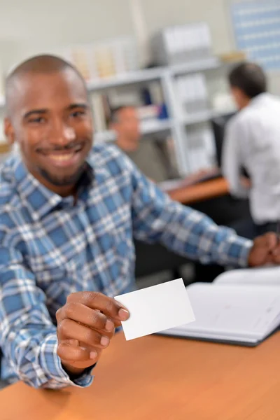 Man holding forward his business card — Stock Photo, Image