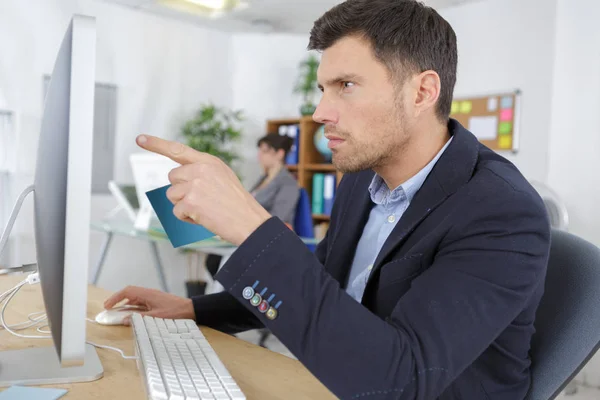 Successful businessman pointing the screen — Stock Photo, Image