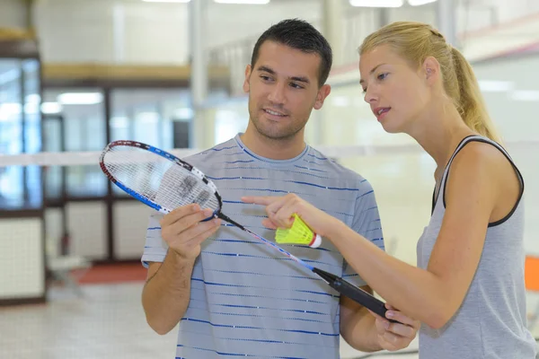 Couple with badminton rackets in hands Stock Picture