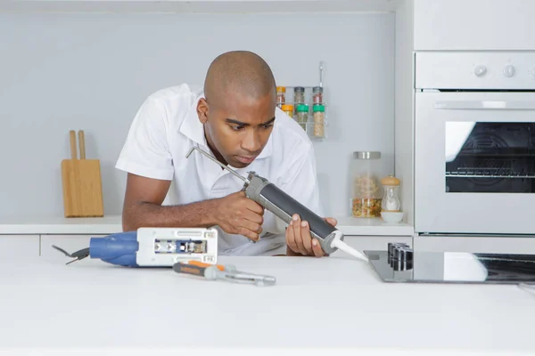 Handyman applying epoxy and electrician — Stock Photo, Image