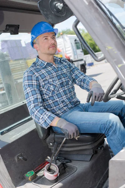 Man driving industrial machine — Stock Photo, Image