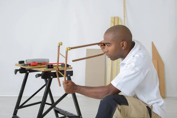 pipe worker tightening a bolt