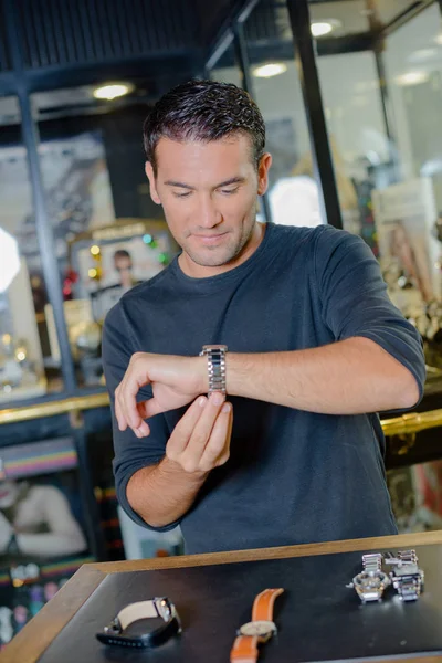 Man trying on watch on jewellers — Stock Photo, Image