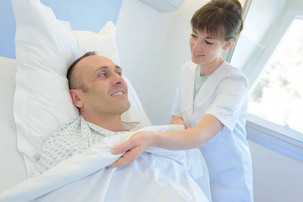 Young Doctor Taking Care Patient — Stock Photo, Image