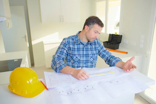 Architect concept architects working with blueprints in the office — Stock Photo, Image