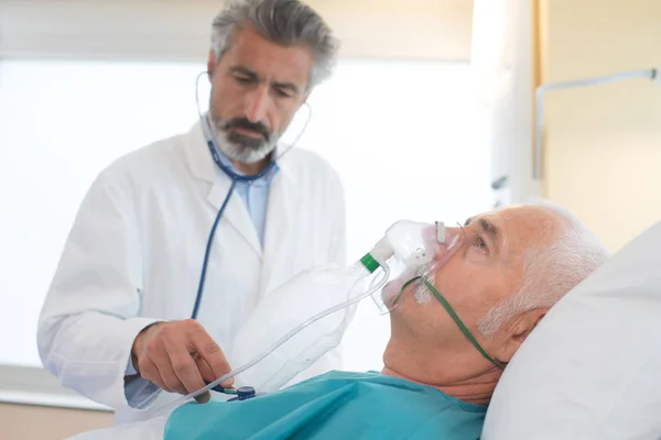 Doctor Helping Collapsed Man Wearing Breathing Mask — Stock Photo, Image