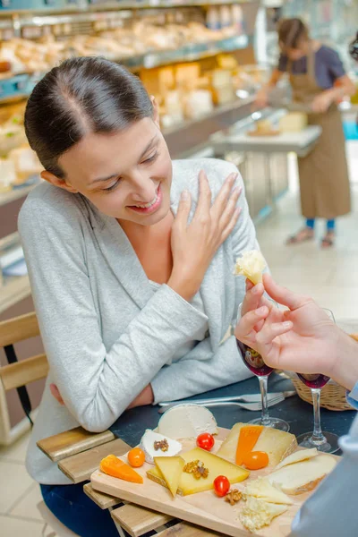 Lady Having Meal Being Offered Cheese — Stock Photo, Image