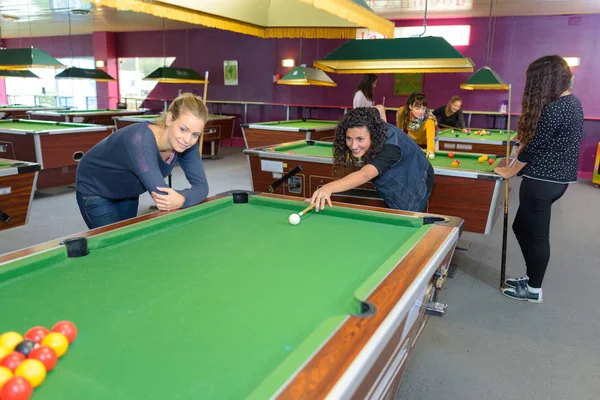 Ladies playing pool and female — Stock Photo, Image