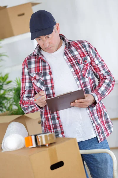 Relocation Service Manager und Paket — Stockfoto