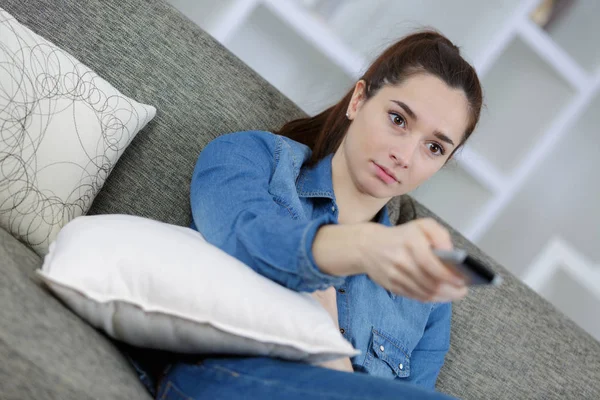 Picture of happy teenage girl with tv remote — Stock Photo, Image