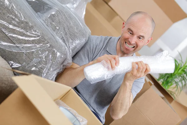 Fired man carrying a box of personal items — Stock Photo, Image