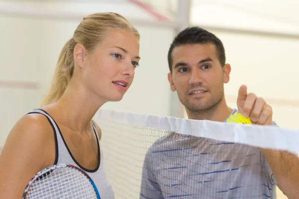 Players communicating indoors and couple — Stock Photo, Image