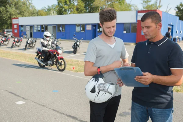 Motorbike test and student — Stock Photo, Image