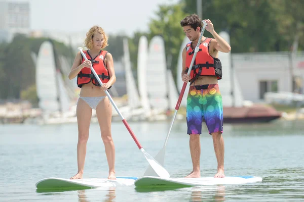 Silhouette of perfect couple engage standup paddle boarding — Stock Photo, Image