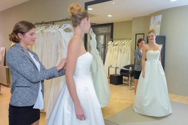 Woman having wedding dress fitting — Stock Photo, Image