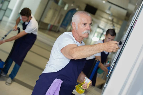 Senior janitor at work — Stock Photo, Image