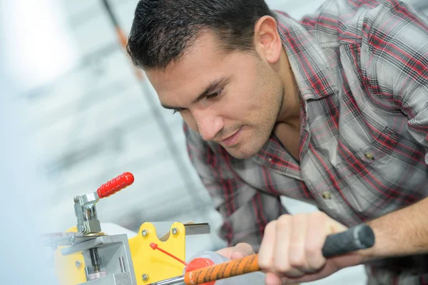Making a design on the rod — Stock Photo, Image