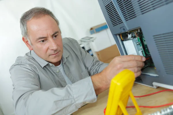 Engineer measuring multimeter panel board — Stock Photo, Image