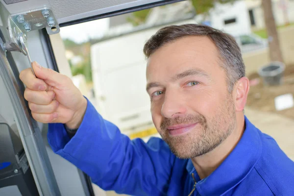 Portrait of mechanic using spanner — Stock Photo, Image