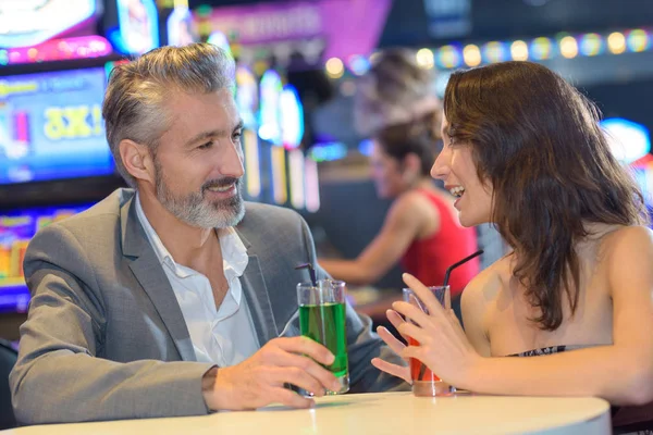 Couple having a date in a casino — Stock Photo, Image