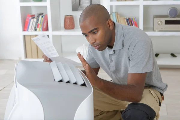 Man Reading Instructions Home Air Conditioning Unit — Stock Photo, Image