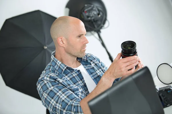 Photographer Inspecting Lens — Stock Photo, Image