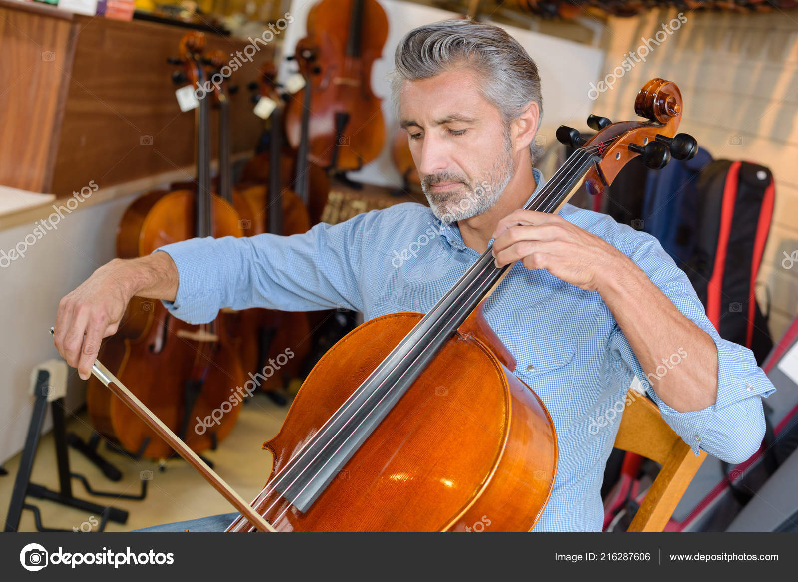 Mature Violin Maker While Testing Violins His Laboratory Stock Photo by