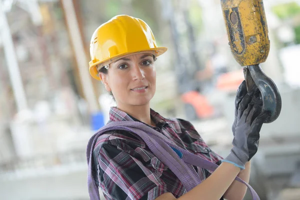 Pretty Female Worker Holding Crane Hook — Stock Photo, Image