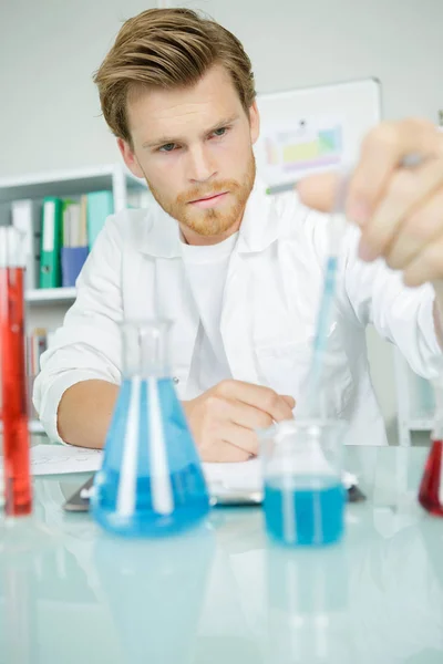 Young Chemist Makes Chemical Test — Stock Photo, Image