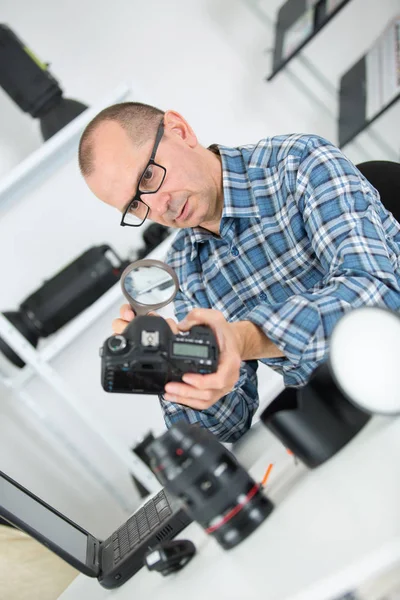 Mature Photographer Checking His Camera Magnifying Glas — Stock Photo, Image