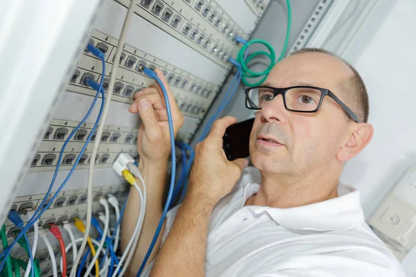 Tradesmen Installing Distribution Board — Stok fotoğraf