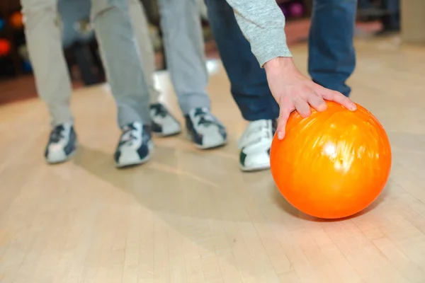 Man Leaning Pick Bowling Ball — Stock Photo, Image