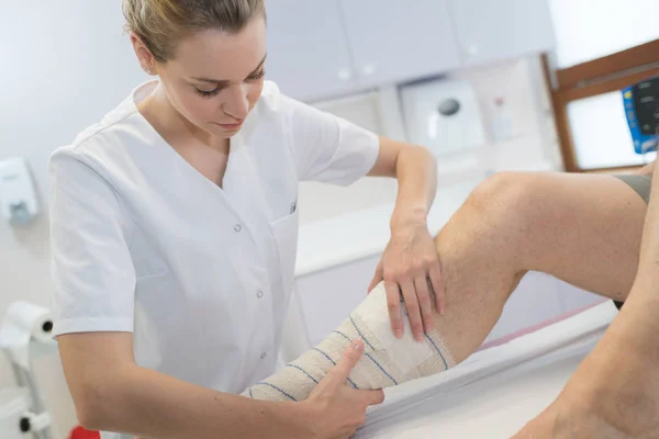 Nurse Bandaged Foot — Stock Photo, Image