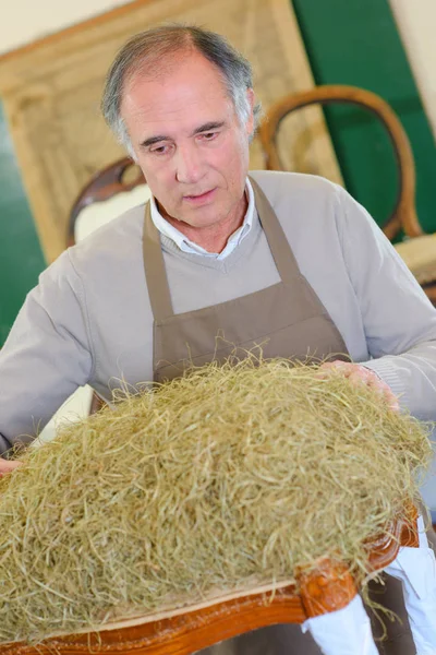Farmer Inspecting Some Hay — Stock Photo, Image