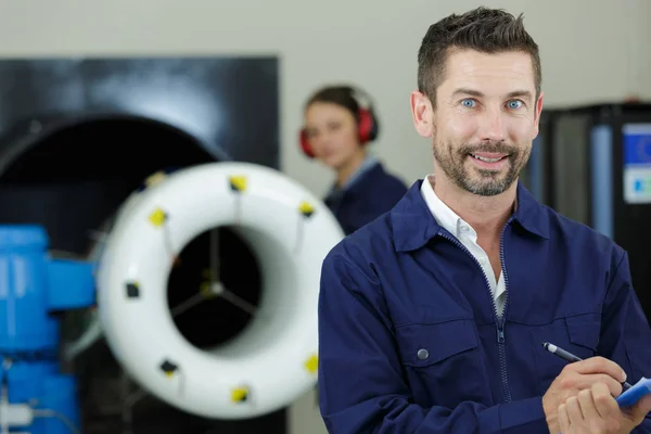 Portrait of male aero engineer with clipboard — Stock Photo, Image