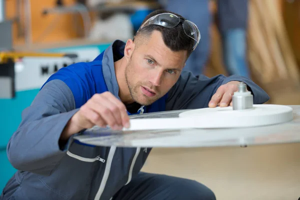 Craftsman in workshop and man — Stock Photo, Image