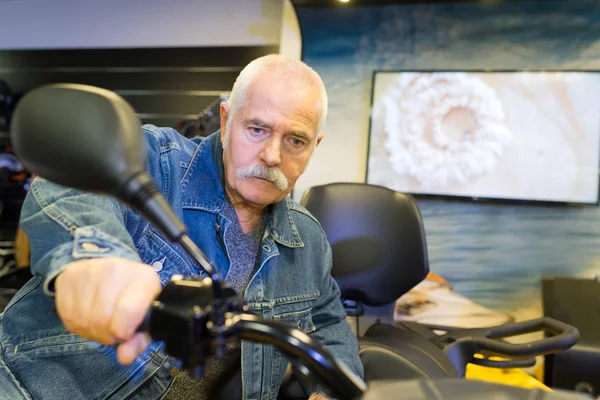 Snior man on a motorcycle — Stock Photo, Image