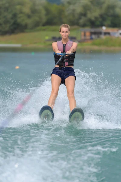 Woman doing water-ski and skii — ストック写真