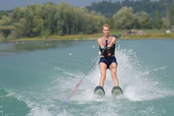 Woman on a water ski — ストック写真
