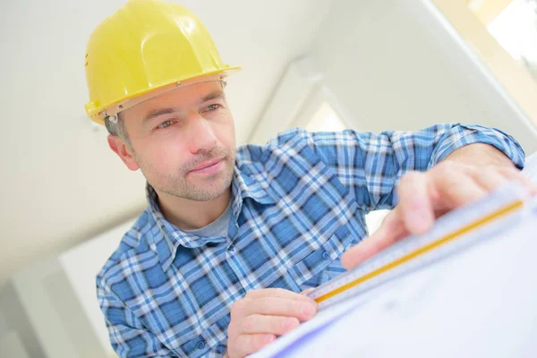 Architect with compass measuring living house blueprint — Stock Photo, Image