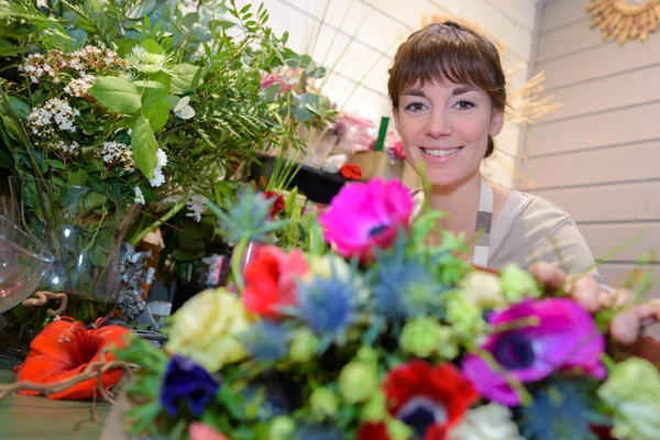 Portrait of beautiful happy florist woman — Stock Photo, Image