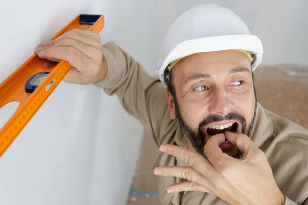 Contractor calling colleague for help — Stock Photo, Image