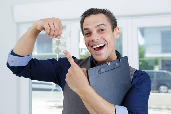 Happy Sales Manager Holding House Key — Stock Photo, Image