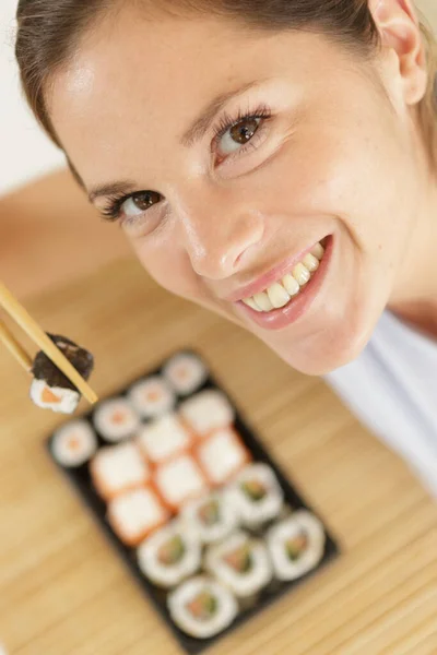 Woman Holding Sushi Chopsticks — Stock Photo, Image